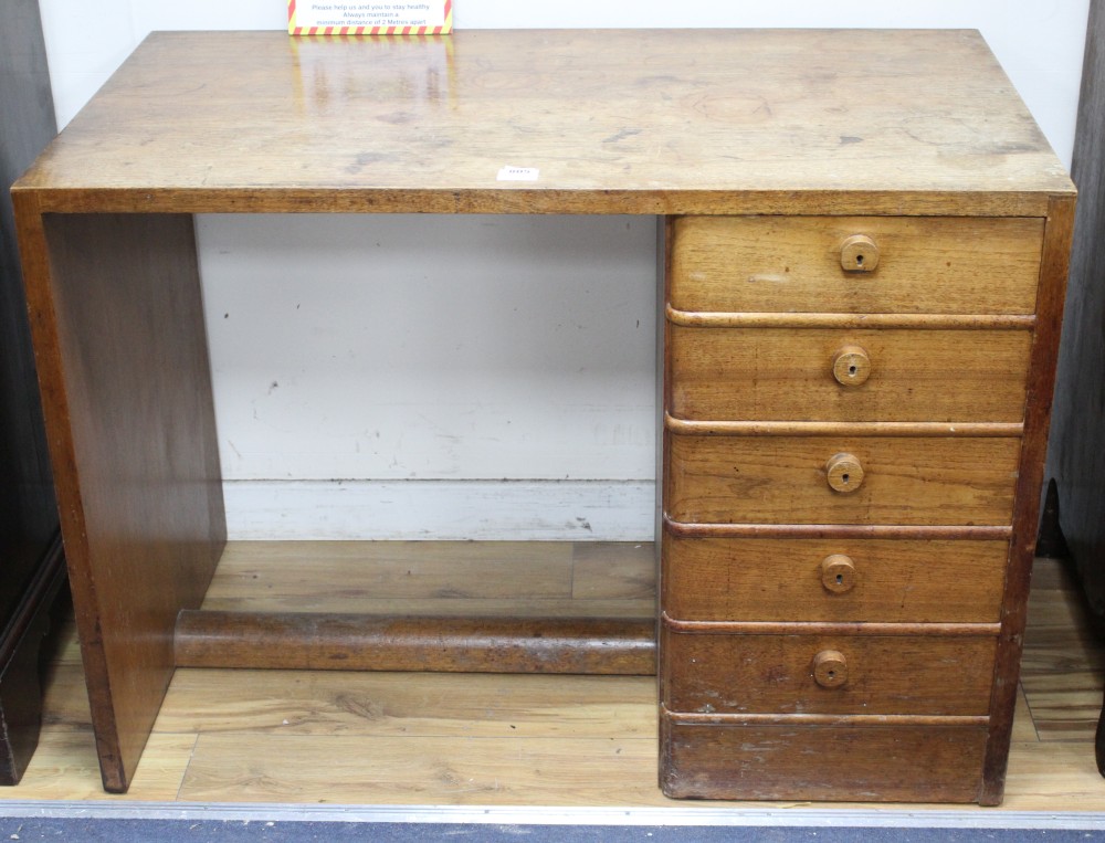 A Gordon Russell teak desk, with single tier of five drawers, W.107cm D.60cm H.77cm